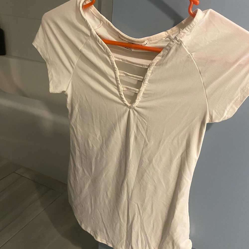 Eye Candy  size small cream colored/off white cute laddered front
